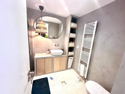 a bathroom with a sink and a mirror at Luxury 6 bedroom 4 bathroom villa with pool in Vari