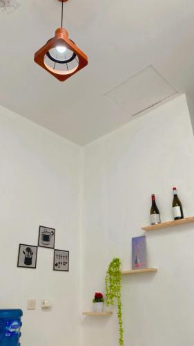 a ceiling light and shelves in a room at Homestay Pangandaran in Pangandaran