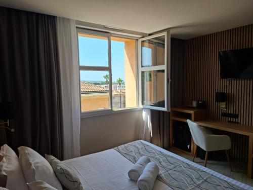 Ένα ή περισσότερα κρεβάτια σε δωμάτιο στο Best Western Plus Sanary
