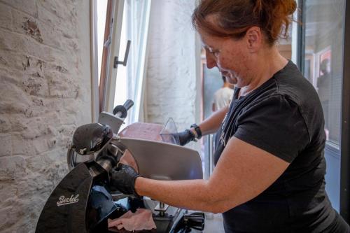 a woman working on a motorcycle in a room at Hotel Casa W in Venice