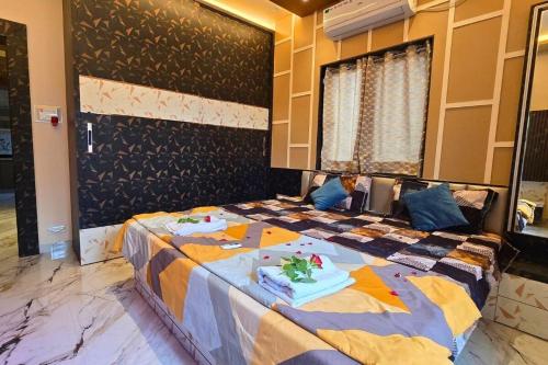 a bedroom with a bed with a cake on it at Lux Pvt Pool, Rain Dance, Near Bhimashankar, Pets! in Manchar