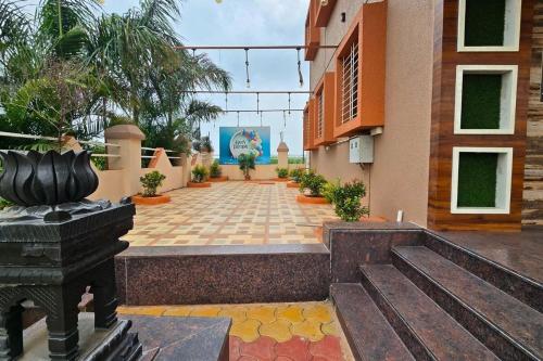 a courtyard of a building with plants on it at Lux Pvt Pool, Rain Dance, Near Bhimashankar, Pets! in Manchar