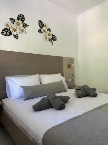 Ένα ή περισσότερα κρεβάτια σε δωμάτιο στο Sandi's House