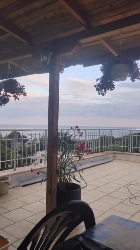 a view of a balcony with a view of the ocean at apartment VANESA in Kavarna