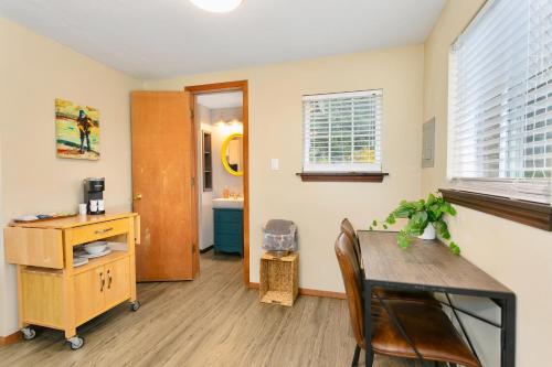 a dining room with a table and a desk at Breakwater Resort in Grayland