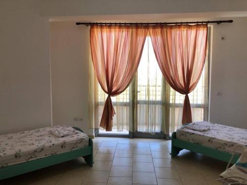 Llit o llits en una habitació de Adan's Apartament