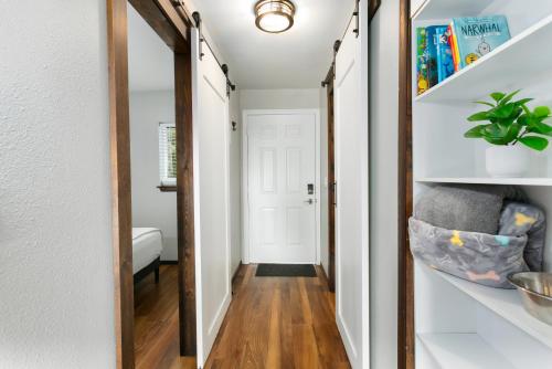 a hallway with a mirror and a chair in a room at Breakwater Resort in Grayland