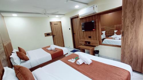 Postel nebo postele na pokoji v ubytování Hotel Sun PLaza