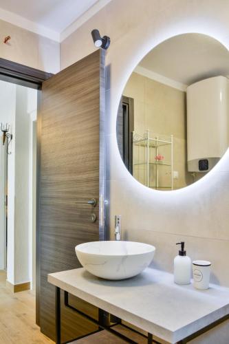 a bathroom with a sink and a mirror at Mata in Sveti Juraj