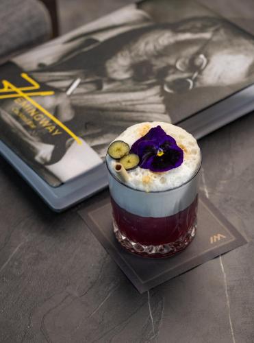a dessert sitting on a table next to a book at Idou Malabata Beach and SPA in Tangier