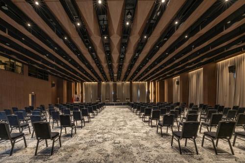 a room with rows of chairs in a hall at Idou Malabata Beach and SPA in Tangier