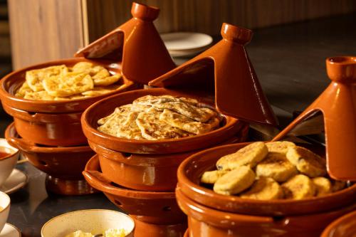 a bunch of baskets filled with food on a table at Idou Malabata Beach and SPA in Tangier