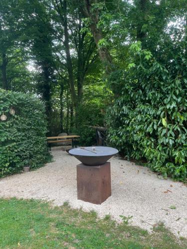 a bird bath sitting in the middle of a park at Basement Tomorrowland 2025 in Mellet