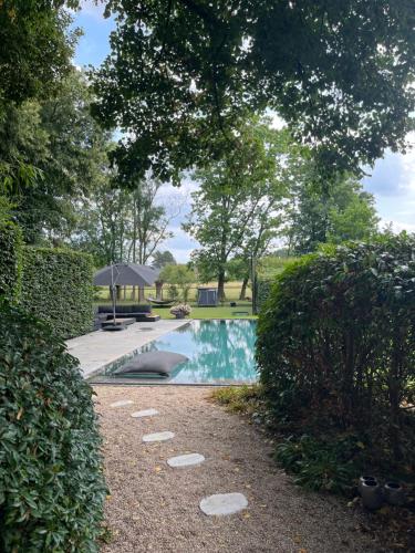 a swimming pool in the middle of a yard at Basement Tomorrowland 2025 in Mellet