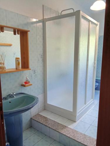 a bathroom with a shower and a sink at Casa Presenza in Santa Elisabetta