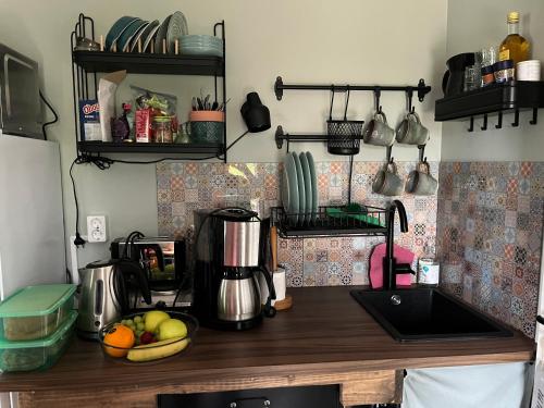 a kitchen with a counter top with a coffee maker at Trhastbb in Herräng