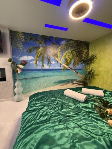 a bedroom with a palm tree mural on the wall at Ferienwohnung SPA Delluxe 2 in Mülheim an der Ruhr