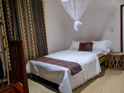 Ένα ή περισσότερα κρεβάτια σε δωμάτιο στο INEZA Guest House