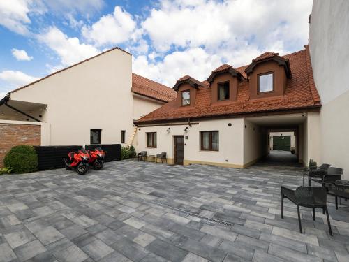 a motorcycle parked in front of a house at Craft Inn - Boutique Hotel in Sibiu