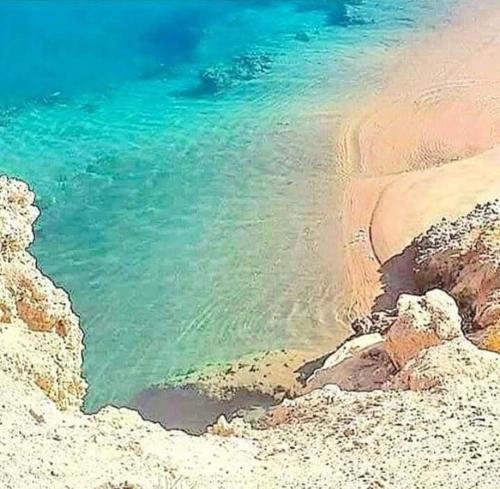 a view of a beach with the water at Eraclea Minoa Apartments in Eraclea Minoa