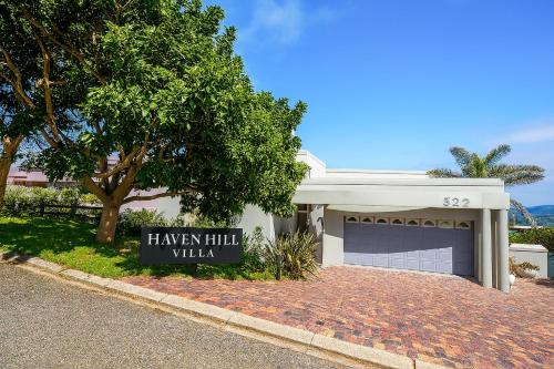 a house with a sign that says hailey hill villa at Haven Hill in Knysna