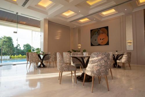 a dining room with a table and chairs at Miros - Formerly Imperial Goa in Old Goa