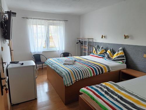 Postel nebo postele na pokoji v ubytování Rekreačný dom Railip