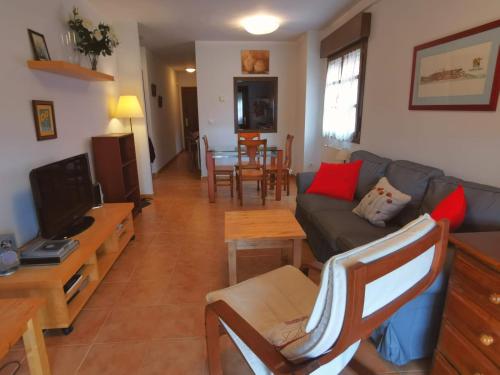 a living room with a couch and a table at Playa Ribadesella Cris in Ribadesella