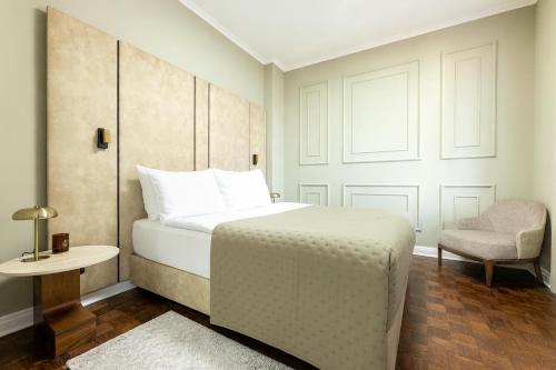 Postel nebo postele na pokoji v ubytování Hotel Majestic