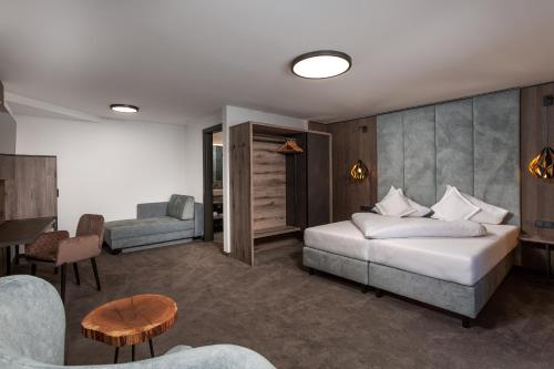 Tempat tidur dalam kamar di Hotel Das Kohlmais