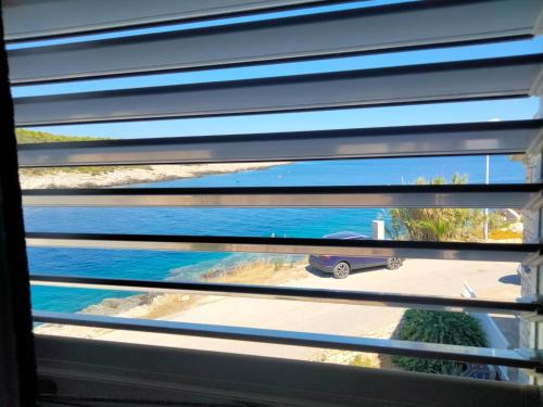 a view of a skateboard through a window with blinds at Appartment Brani & Mira in Rukavac