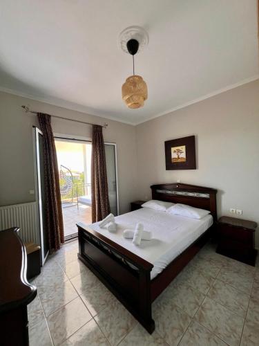 Ένα ή περισσότερα κρεβάτια σε δωμάτιο στο Casa Psarou 1