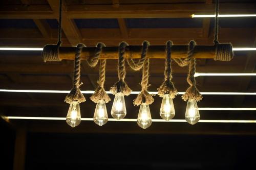 a bunch of light bulbs hanging from a pole at Ista Inn Homestay in Amritsar