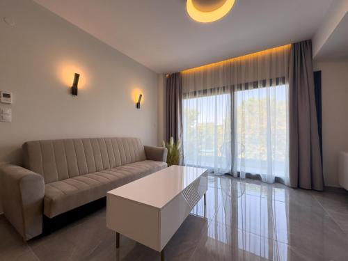 a living room with a couch and a coffee table at VILLA 8 By ProLiving Hospitality in Thessaloniki