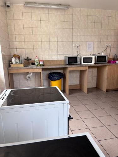 a kitchen with two microwaves on a counter at Ubytování Přimda in Přimda