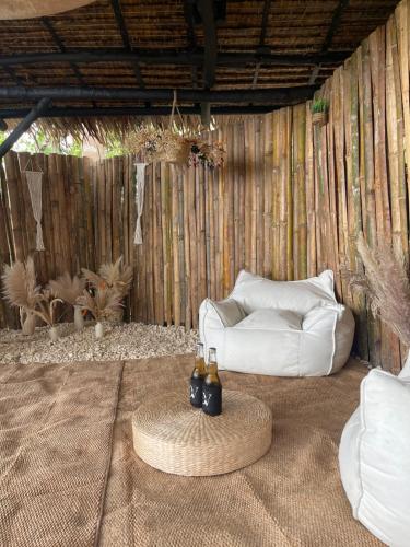 a living room with a white couch and a table at Drako Villas in Siquijor