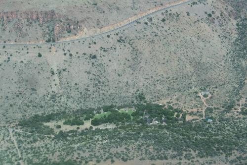an aerial view of a field with trees and a road at Ko Ka Tsara Bush Camp in Beaufort West