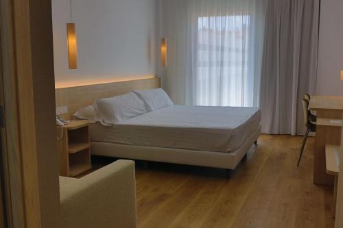 Postel nebo postele na pokoji v ubytování SH Campus Lyceum
