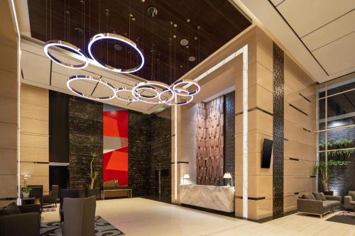 a chandelier in the lobby of a hotel at Melia Makassar in Makassar