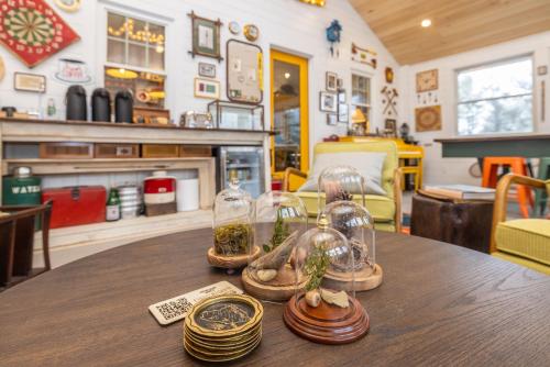 a table with two glass jars on top of it at Camp DeForest in Lincolnville