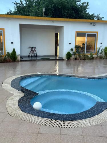 a swimming pool in the middle of a patio at Pali Retreat Riverside Stay with Pool in Pali