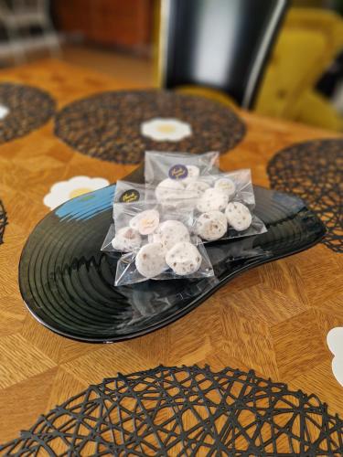a plate of donuts on top of a table at Valmiera Riverside Retreat - Beverina Secret in Ķeiži