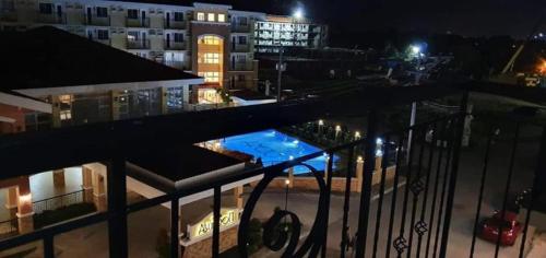 a view of a swimming pool at night at Near SM Lanang & Samal Wharf - 2BR Condo Davao - Netflix in Davao City