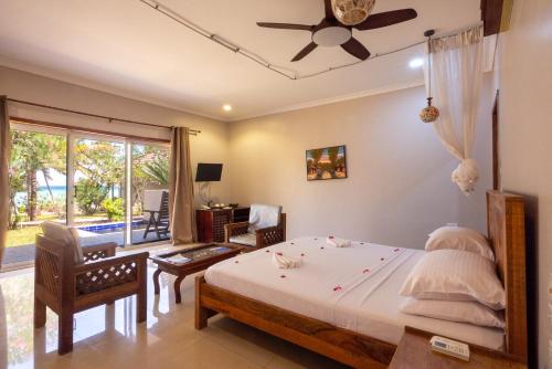 Postel nebo postele na pokoji v ubytování Mandarin Resort Zanzibar