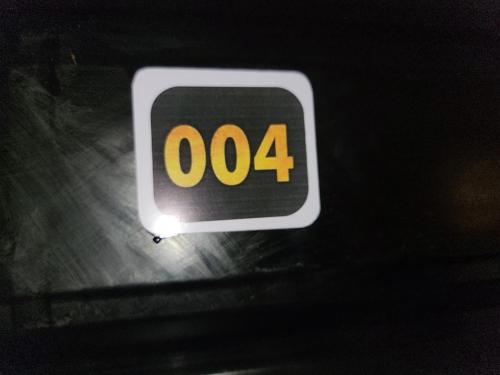 a sign with the on it sitting on a table at Caesar's Hotel & Apartment Room 6 in Ikeja
