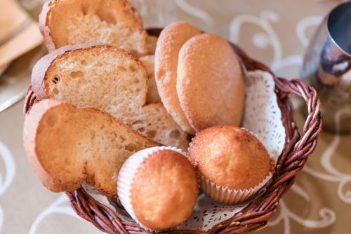 a basket filled with different types of bread at Hotel Albarrán in Albarracín