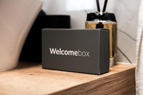 a black box sitting on a wooden shelf at Casa Bianca in Barbat na Rabu