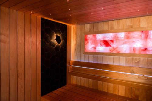 a sauna with wood paneling and a window at Casa Bianca in Barbat na Rabu