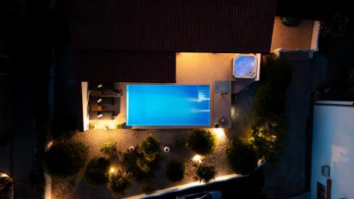 an overhead view of a swimming pool at night at Casa Bianca in Barbat na Rabu