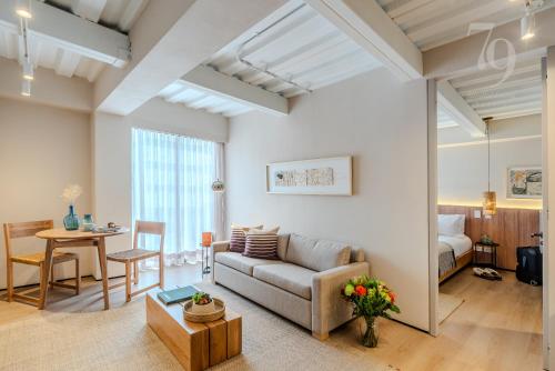 a living room with a couch and a table at 79bogotá Boutique Suites in Bogotá